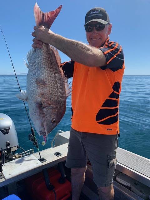 Lloyd with his first ever snapper on slow jigs